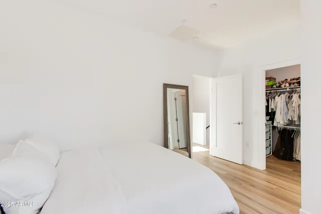 a bedroom with a washer and dryer