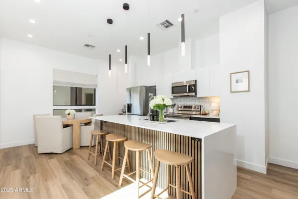 a view of a building with potted plants
