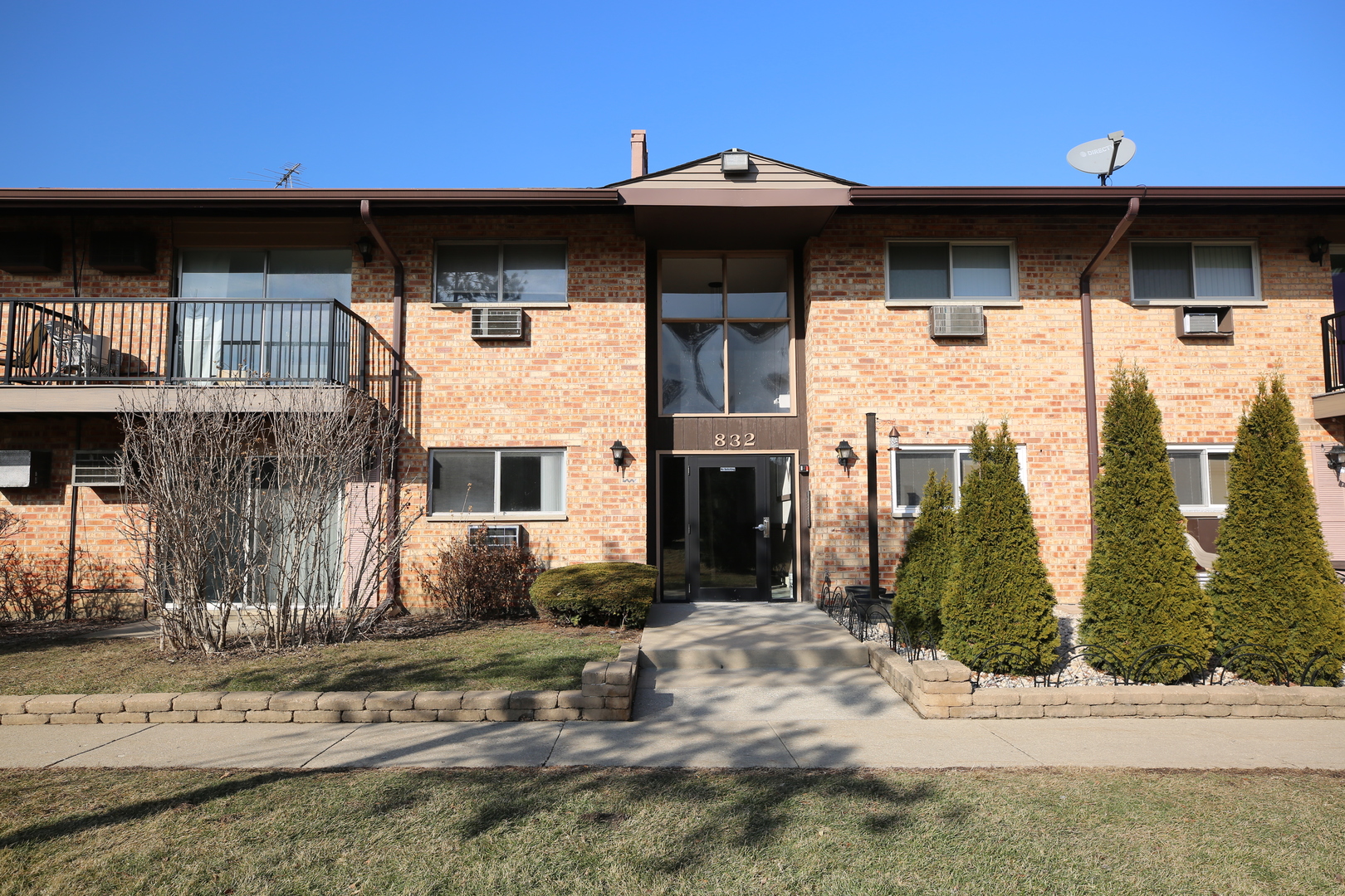 832 East Old Willow Road, Unit 105 Prospect Heights, IL 60070 - Photo 1 of 15 a front view of a house with parking
