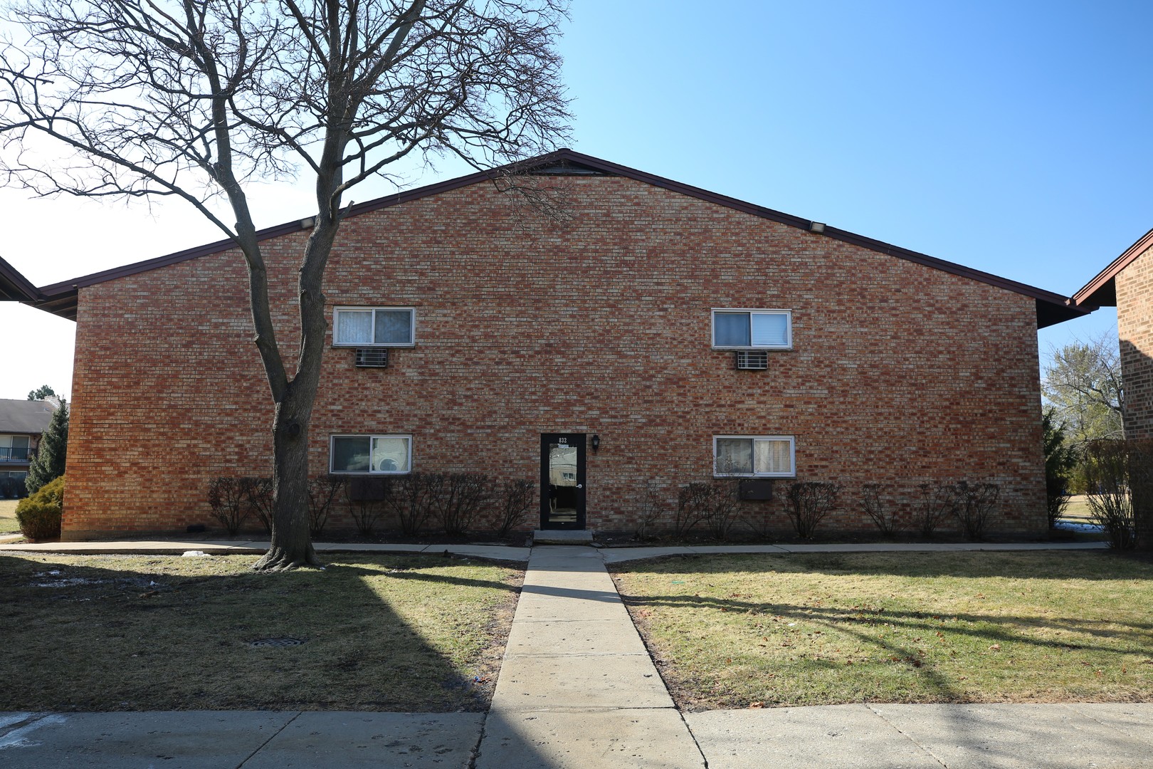 832 East Old Willow Road, Unit 105 Prospect Heights, IL 60070 - Photo 13 of 15 a brick house with tree in front of it