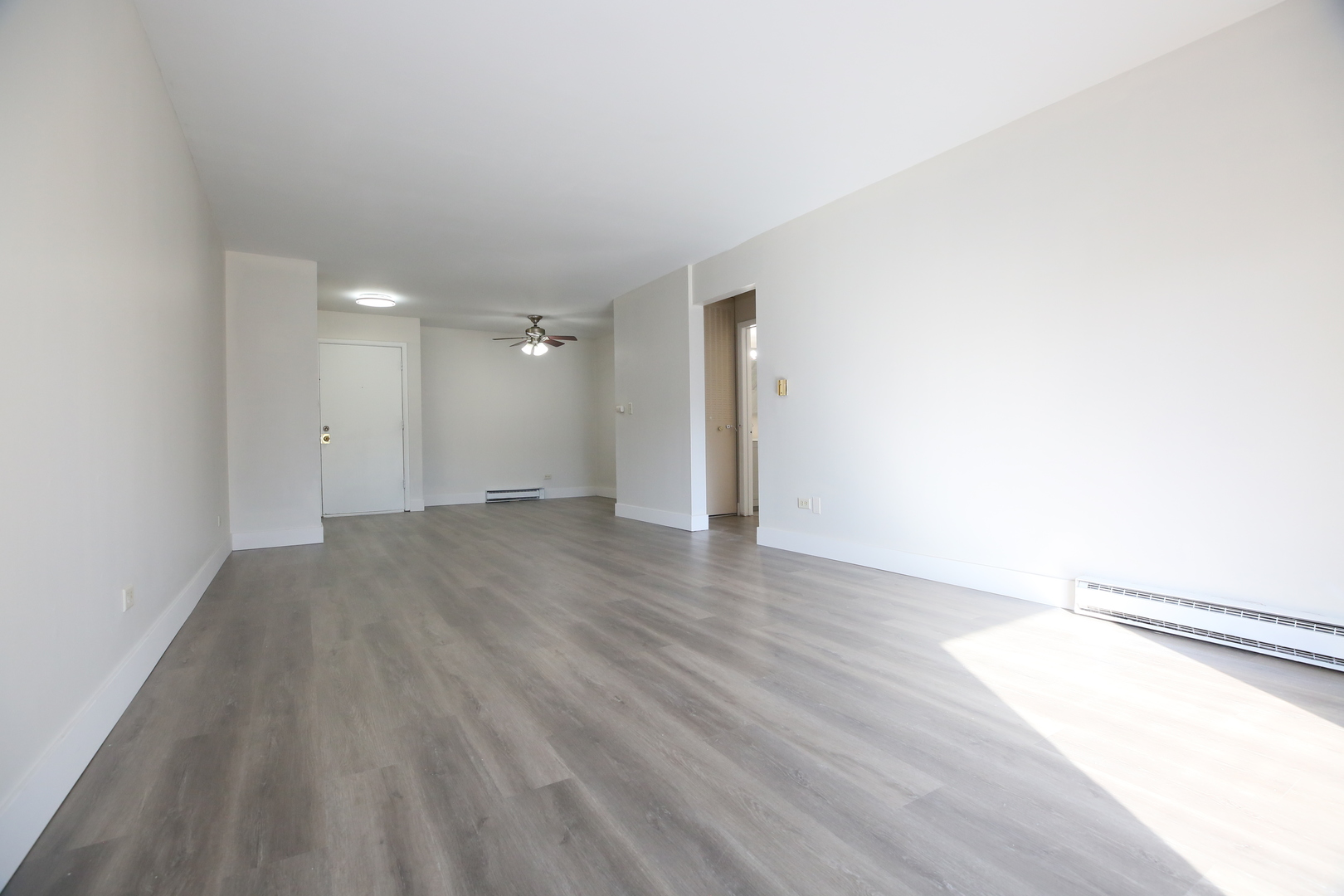 832 East Old Willow Road, Unit 105 Prospect Heights, IL 60070 - Photo 2 of 15 a view of an empty room and wooden floor