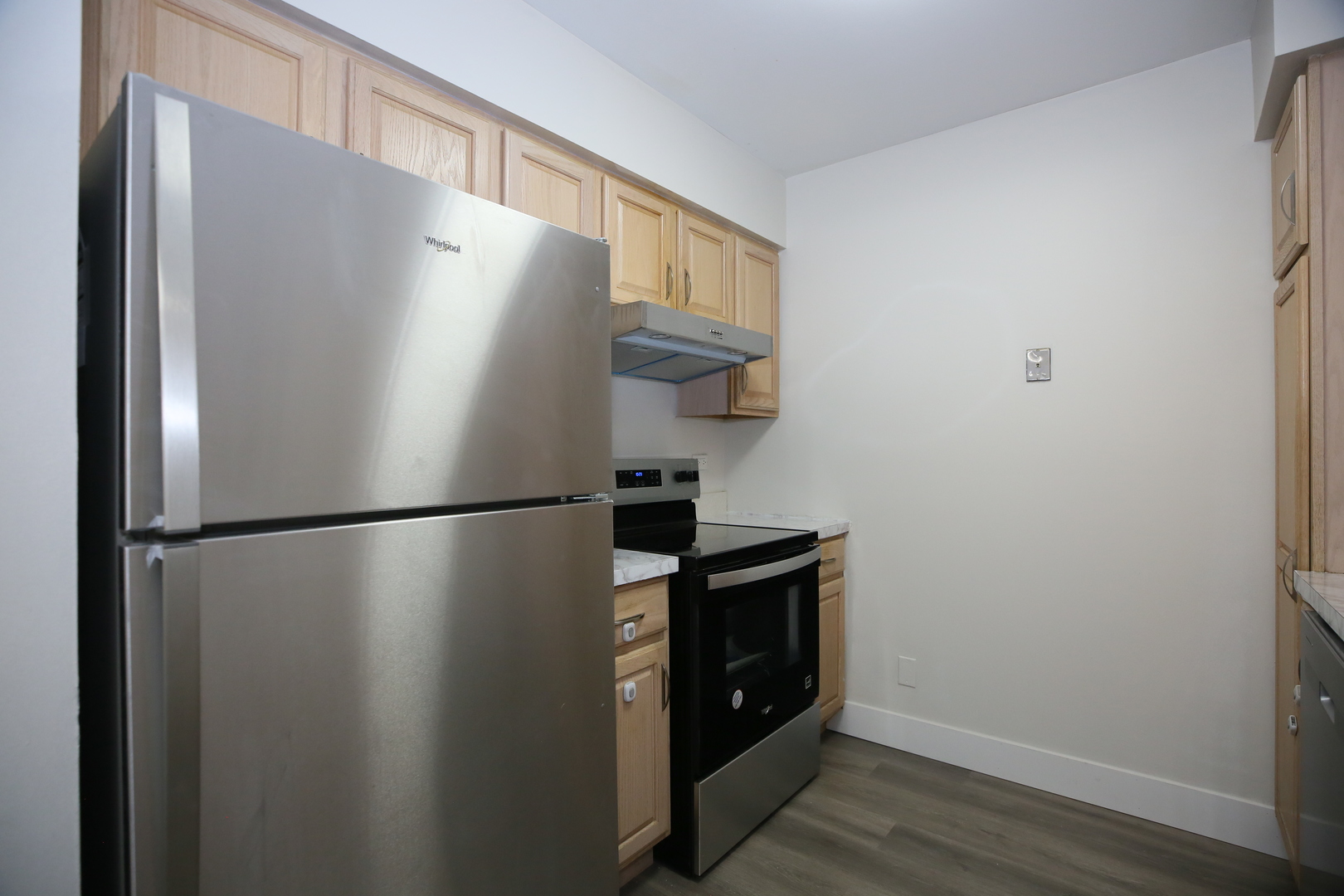 832 East Old Willow Road, Unit 105 Prospect Heights, IL 60070 - Photo 6 of 15 a white refrigerator freezer sitting inside of a kitchen