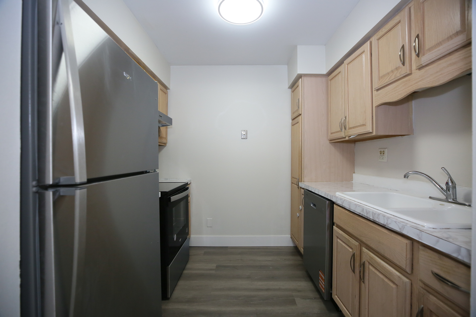 832 East Old Willow Road, Unit 105 Prospect Heights, IL 60070 - Photo 7 of 15 a kitchen with a refrigerator a sink and dishwasher