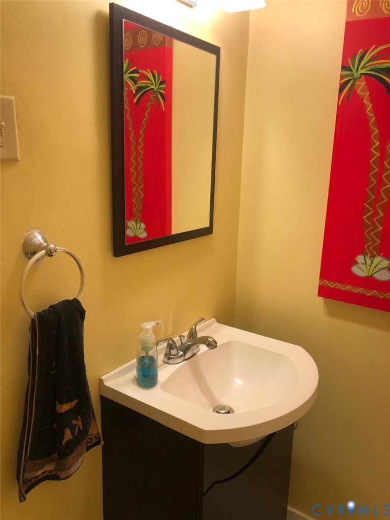 10001 Alfaree Road Richmond, VA 23237 - Photo 10 of 17 Wall-mounted vanity with a white basin and chrome