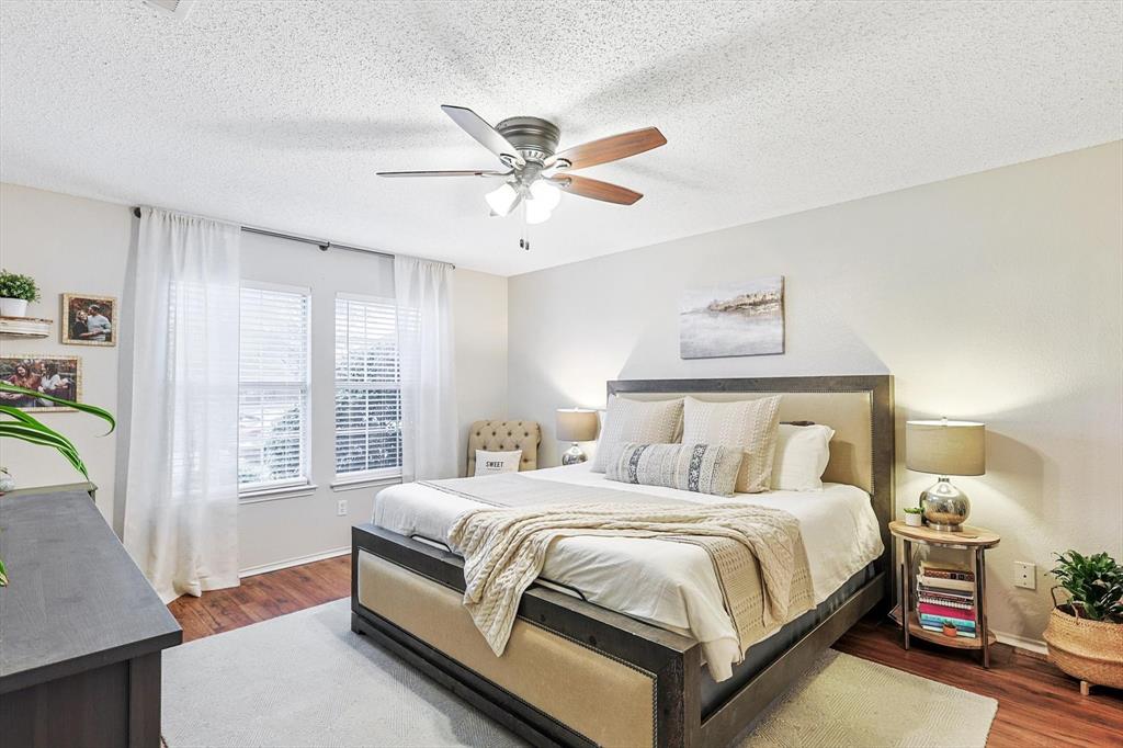 1016 Ridgetop Drive Justin, TX 76247 - Photo 15 of 40 Bedroom with wood finished floors, a textured ceiling, and a ceiling fan