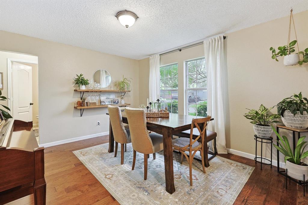 1016 Ridgetop Drive Justin, TX 76247 - Photo 5 of 40 Dining area with wood finished floors and a textured ceiling