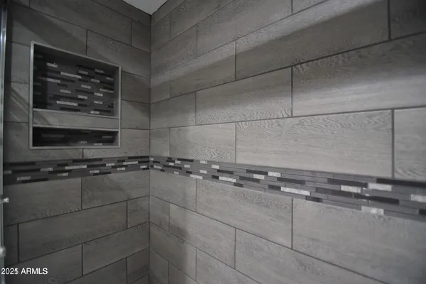 a bathroom with a shower and a sink