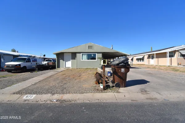 a view of a car park in front of house