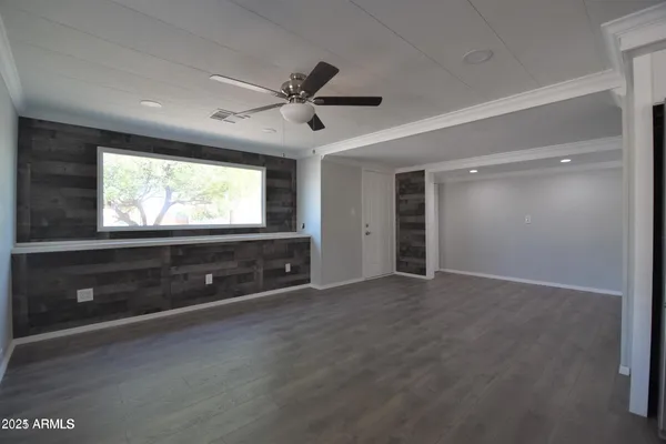 a view of an empty room with a window