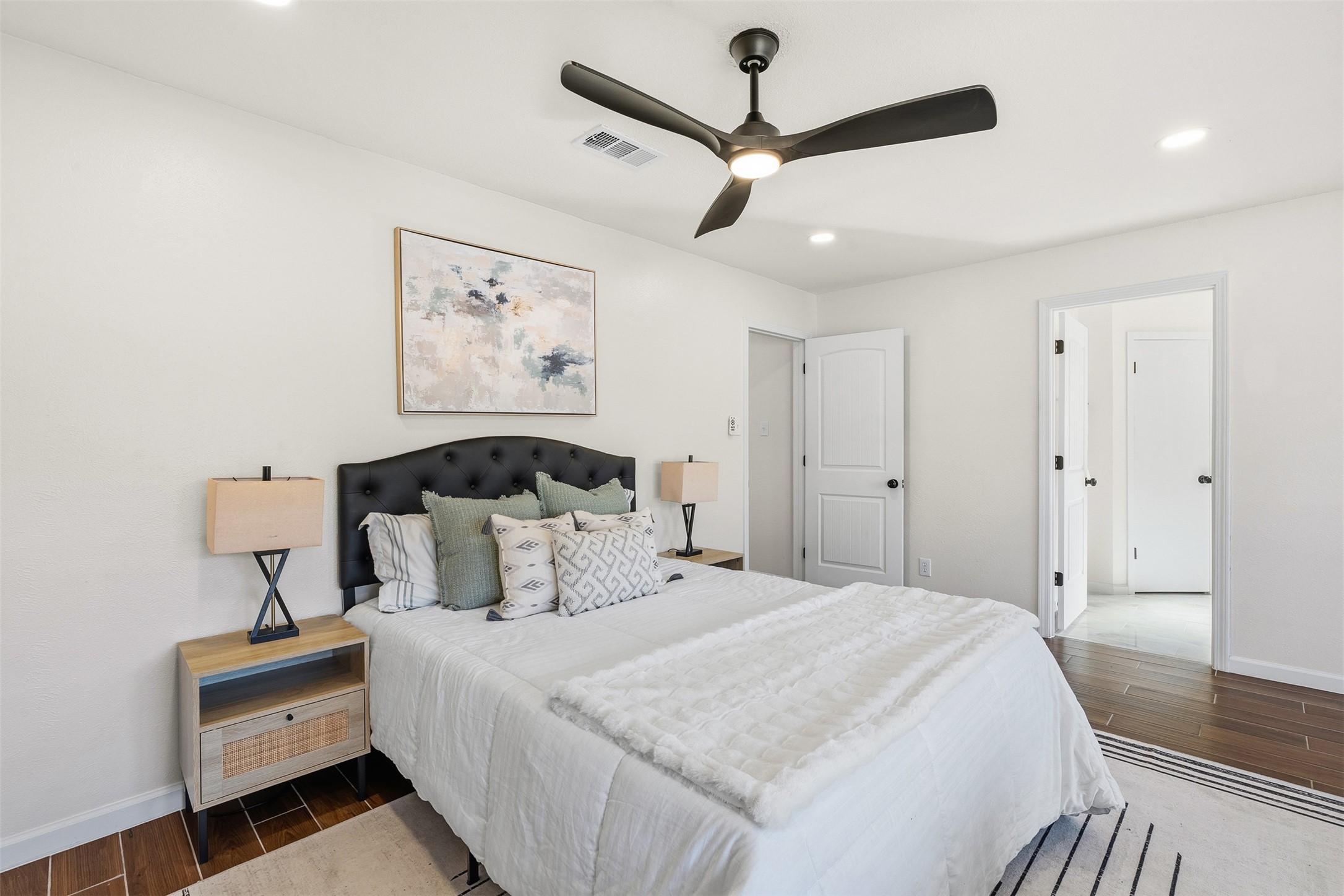 12401 Rusted Nail Cove Austin, TX 78750 - Photo 19 of 34 Bedroom with wood tiled floors, ceiling fan, and recessed lighting