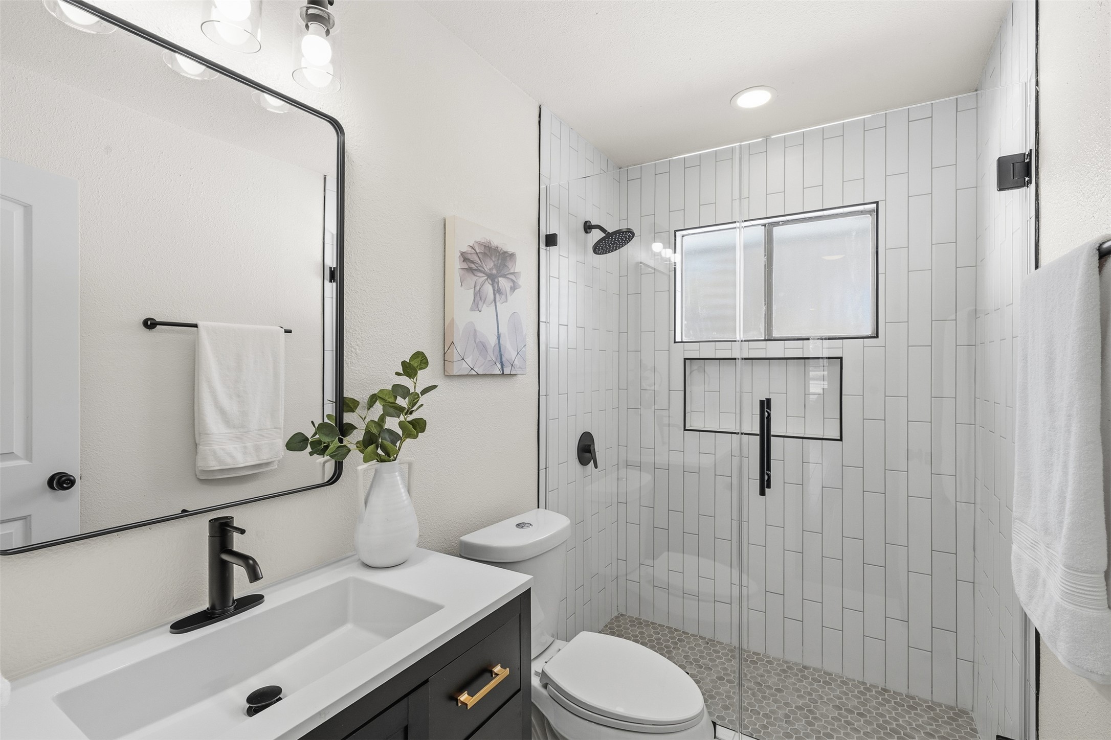 12401 Rusted Nail Cove Austin, TX 78750 - Photo 28 of 34 Full bathroom featuring vanity, a stall shower, and recessed lighting