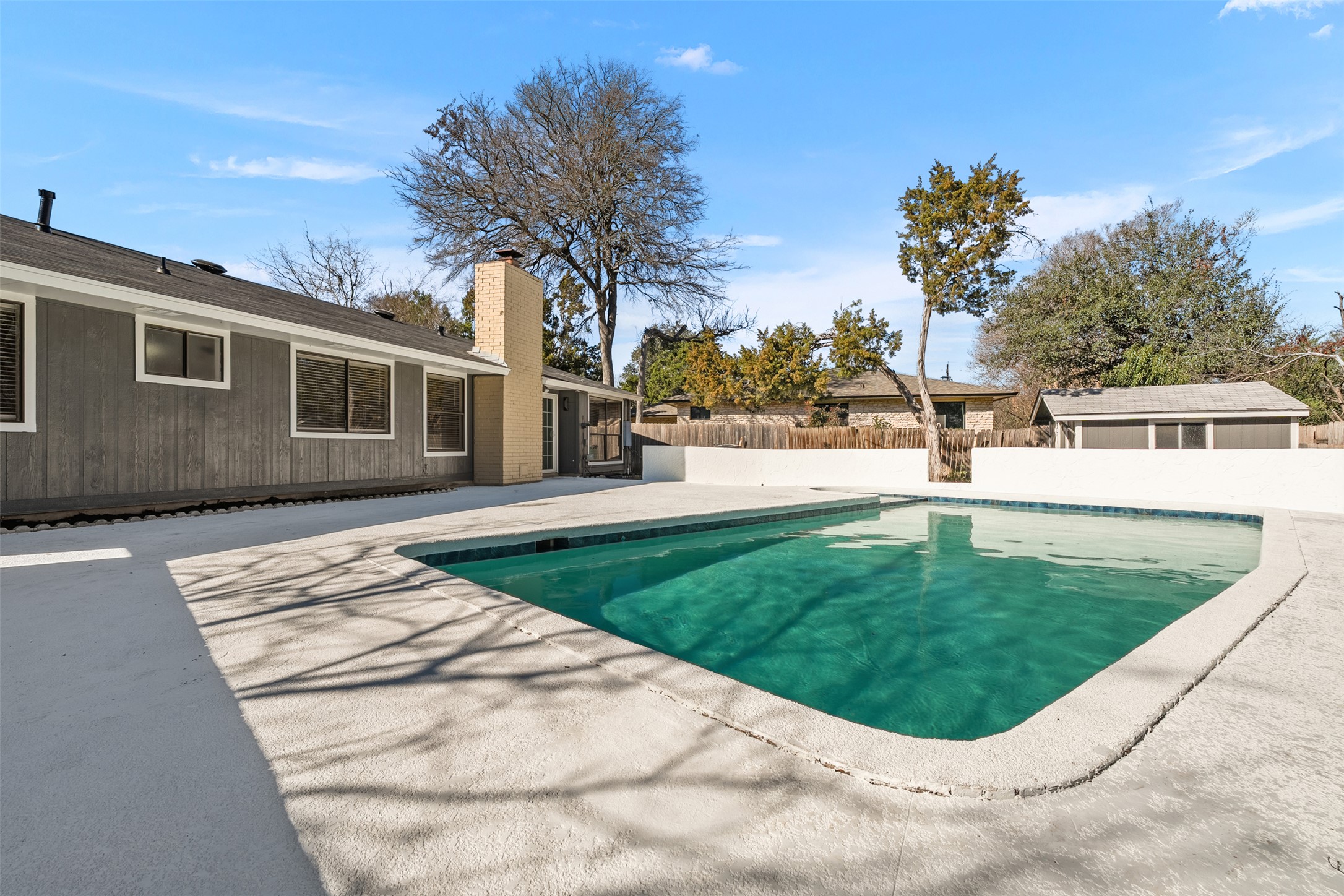12401 Rusted Nail Cove Austin, TX 78750 - Photo 29 of 34 View of swimming pool featuring a fenced backyard, a sunroom, and a patio area