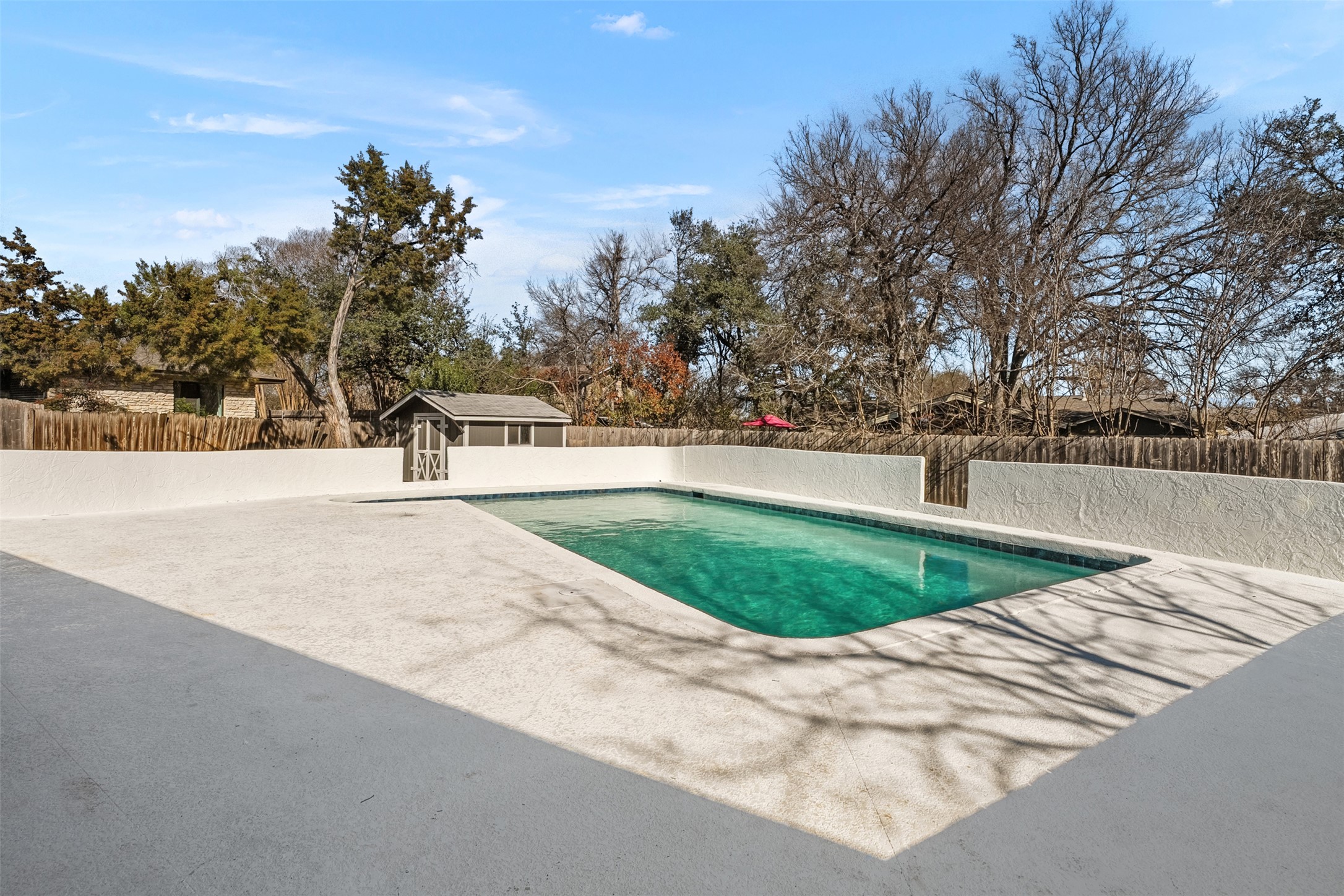 12401 Rusted Nail Cove Austin, TX 78750 - Photo 30 of 34 View of swimming pool with a fenced backyard, an outbuilding, and a patio