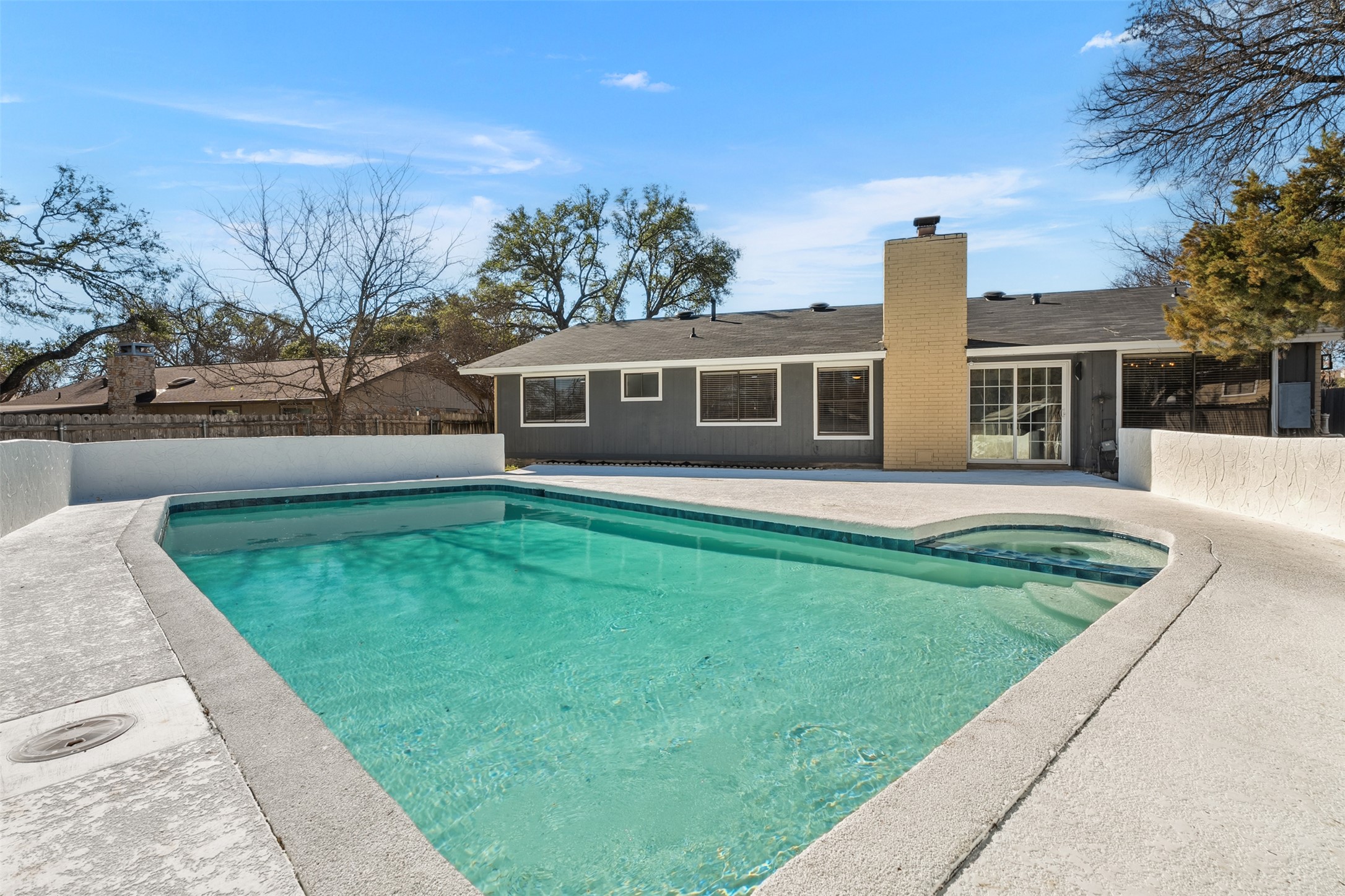 12401 Rusted Nail Cove Austin, TX 78750 - Photo 5 of 34 View of pool with a patio, a fenced backyard, and a pool with connected hot tub