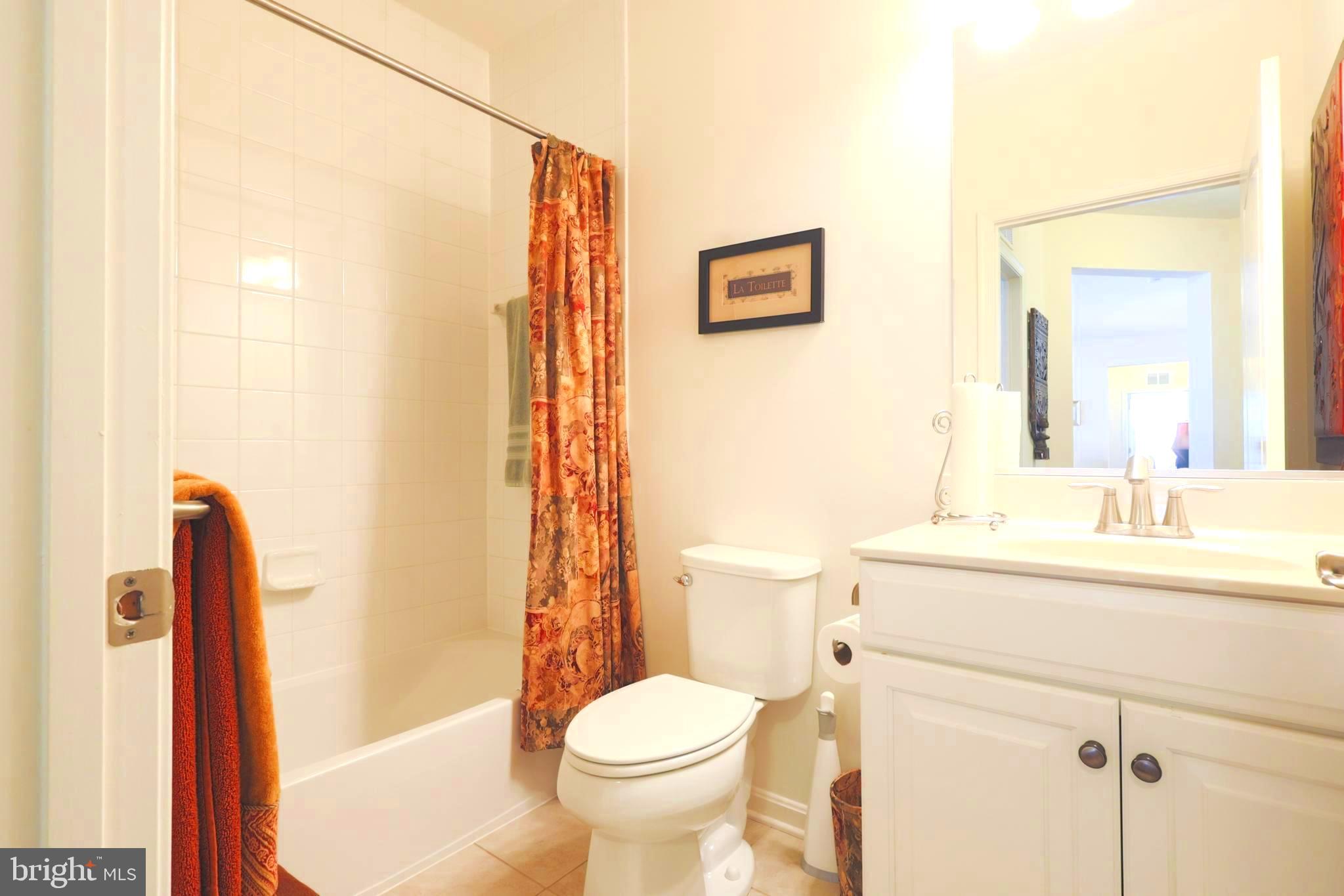 620 Quarry View Court, Unit 407 Reisterstown, MD 21136 - Photo 19 of 25 a bathroom with a sink toilet and shower