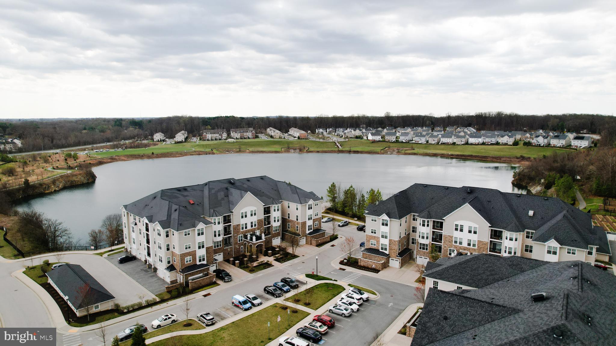 620 Quarry View Court, Unit 407 Reisterstown, MD 21136 - Photo 2 of 25 a view of a lake with couches and city view
