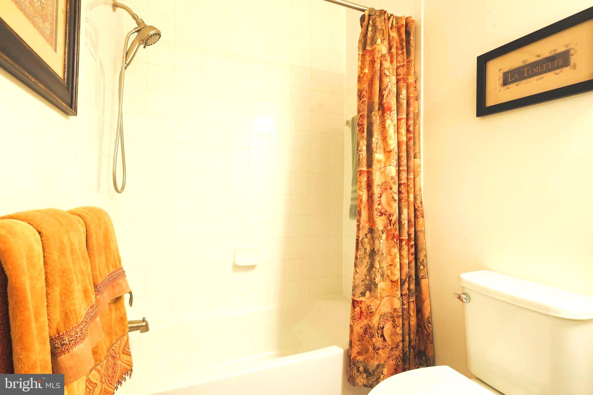 620 Quarry View Court, Unit 407 Reisterstown, MD 21136 - Photo 20 of 25 a bathroom with a toilet sink and shower