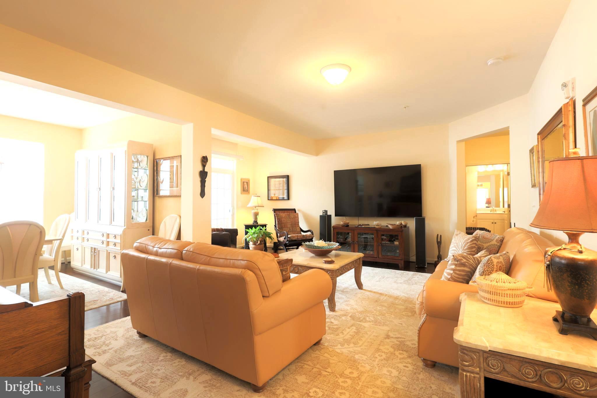 620 Quarry View Court, Unit 407 Reisterstown, MD 21136 - Photo 25 of 25 a living room with furniture and a flat screen tv