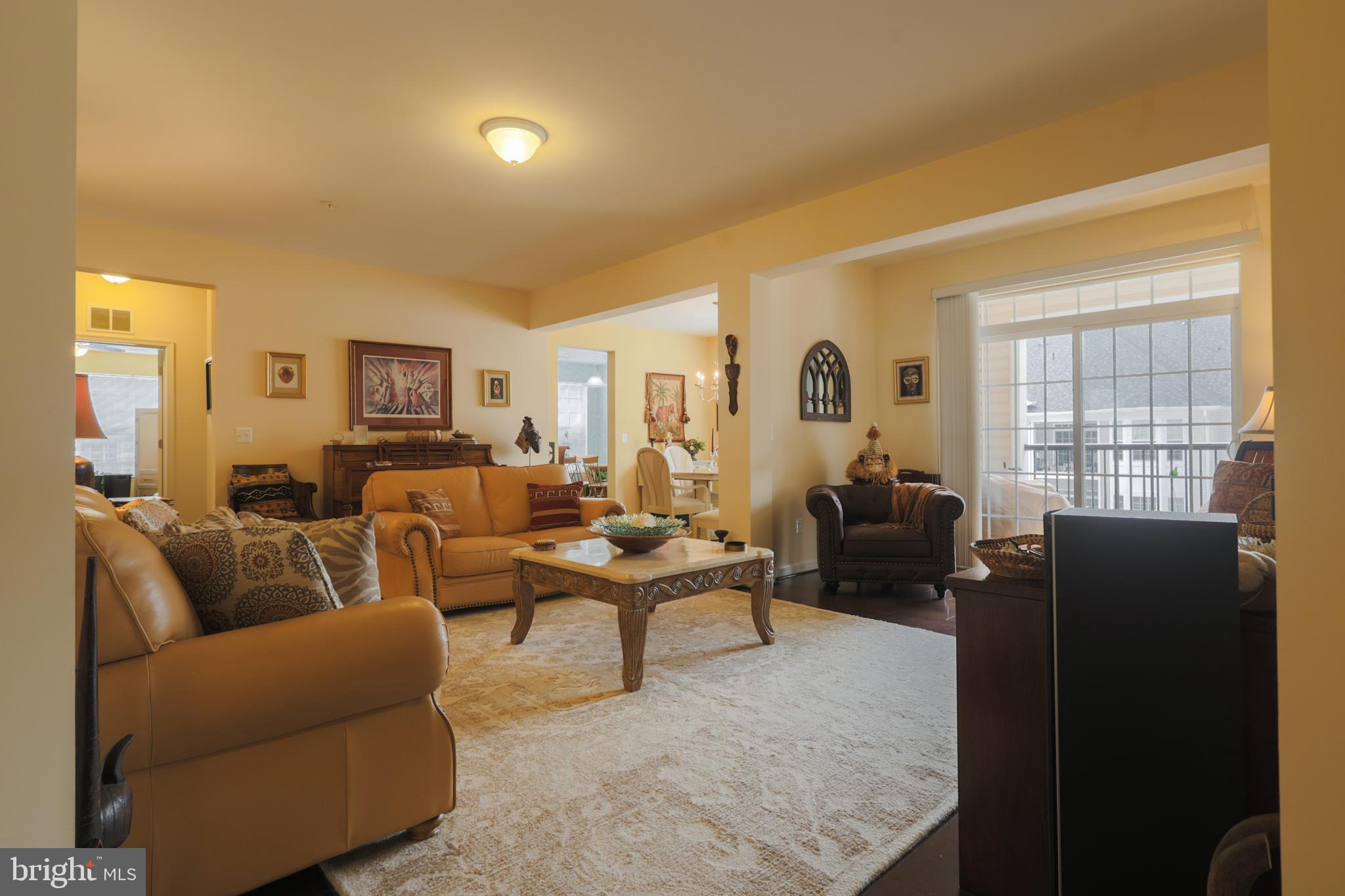 620 Quarry View Court, Unit 407 Reisterstown, MD 21136 - Photo 5 of 25 a living room with furniture potted plant and a window