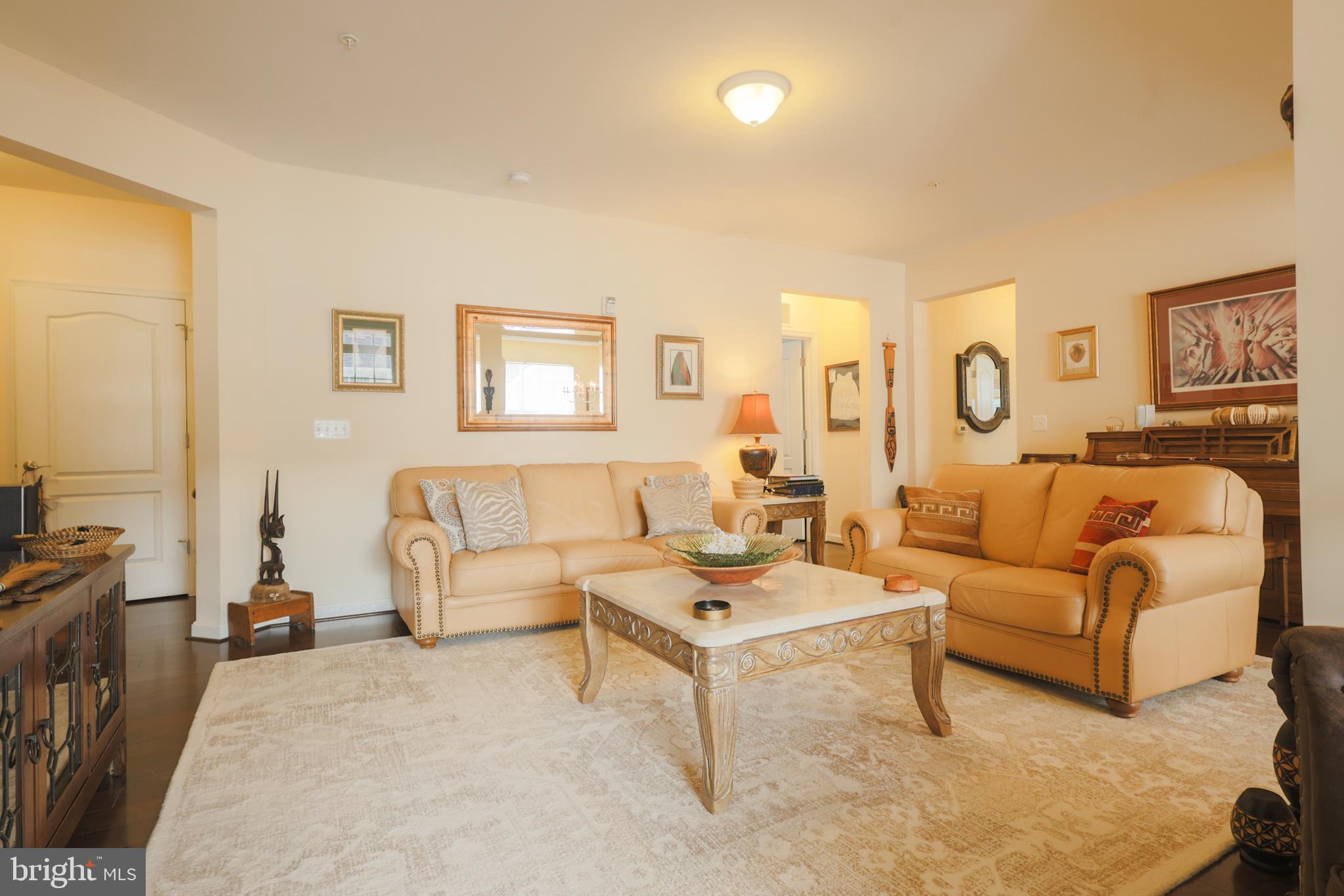 620 Quarry View Court, Unit 407 Reisterstown, MD 21136 - Photo 6 of 25 a living room with furniture and a flat screen tv