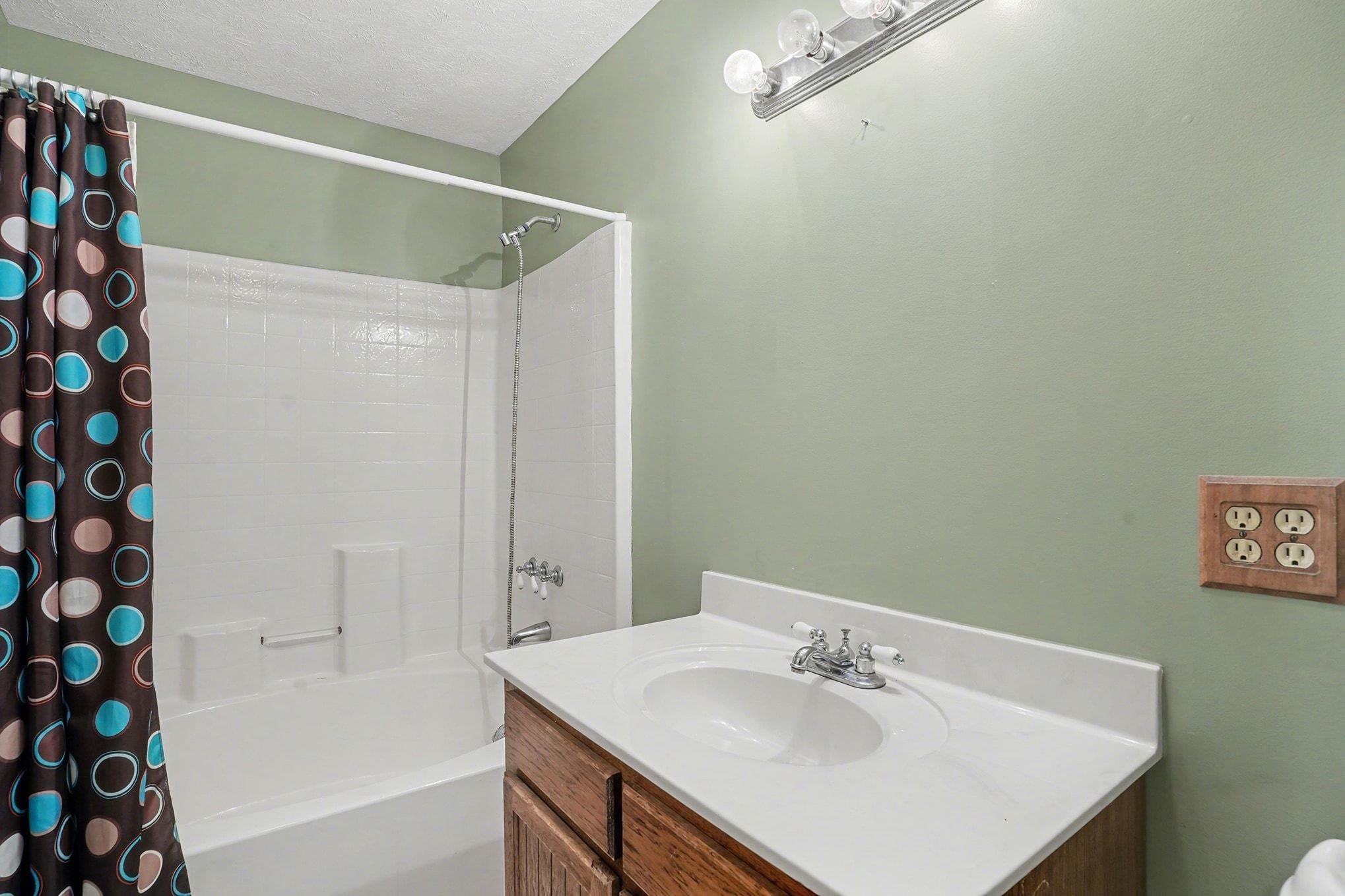 202 Highway 747 Loris Sc 29569 Loris, SC 29569 - Photo 20 of 34 Bathroom with shower / tub combo with curtain and vanity