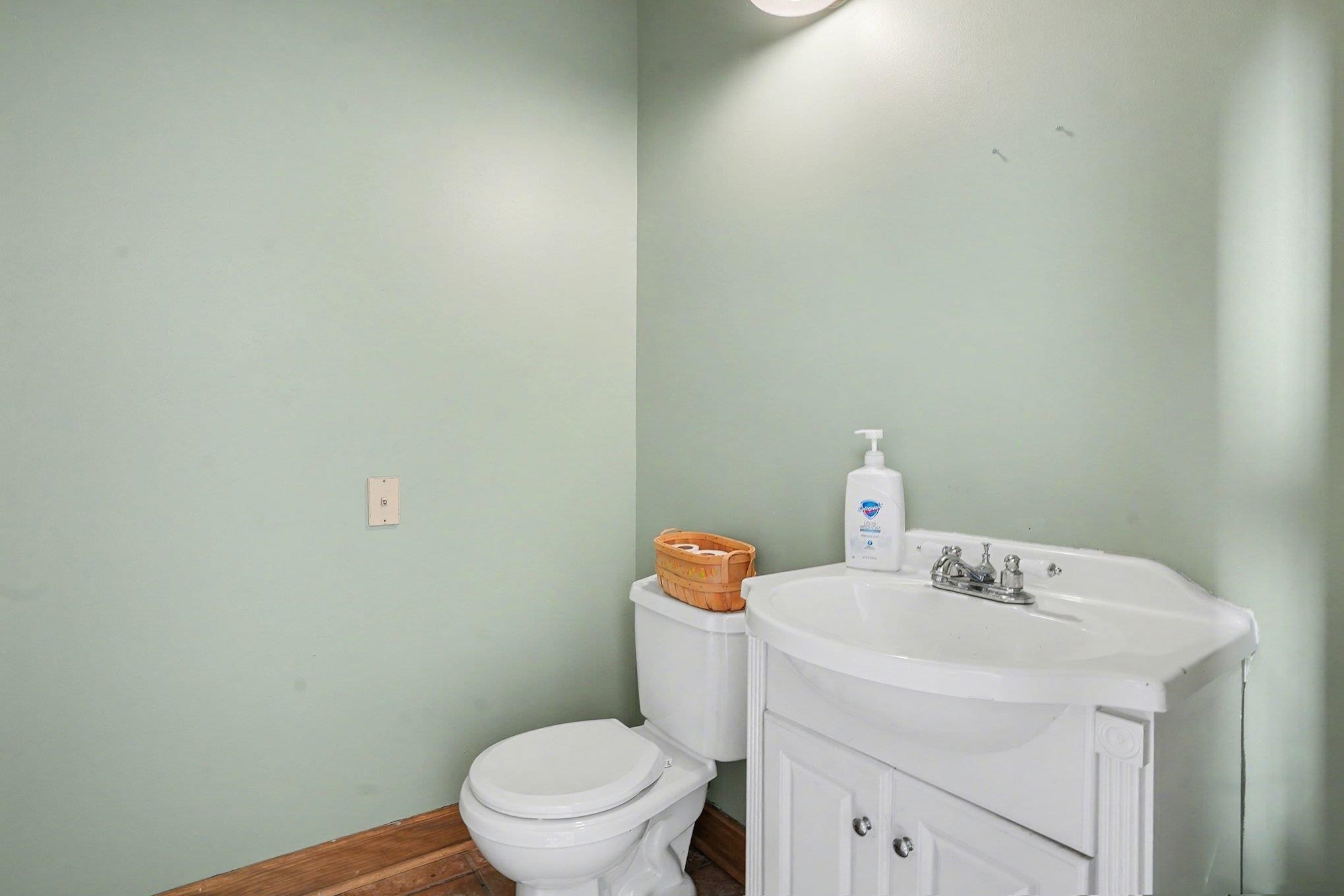 202 Highway 747 Loris Sc 29569 Loris, SC 29569 - Photo 23 of 34 Half bathroom featuring vanity and toilet