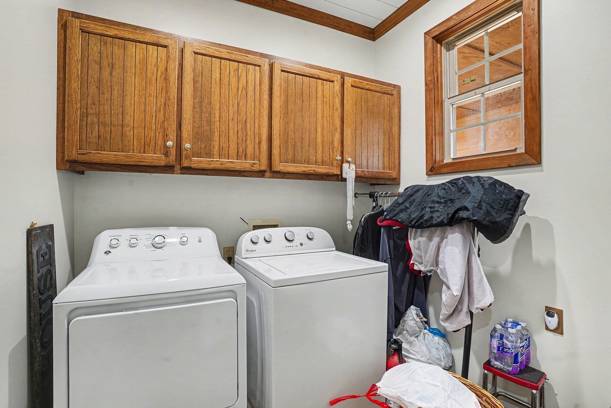 202 Highway 747 Loris Sc 29569 Loris, SC 29569 - Photo 24 of 34 Laundry room featuring ornamental molding, independent washer and dryer, and cabinet space