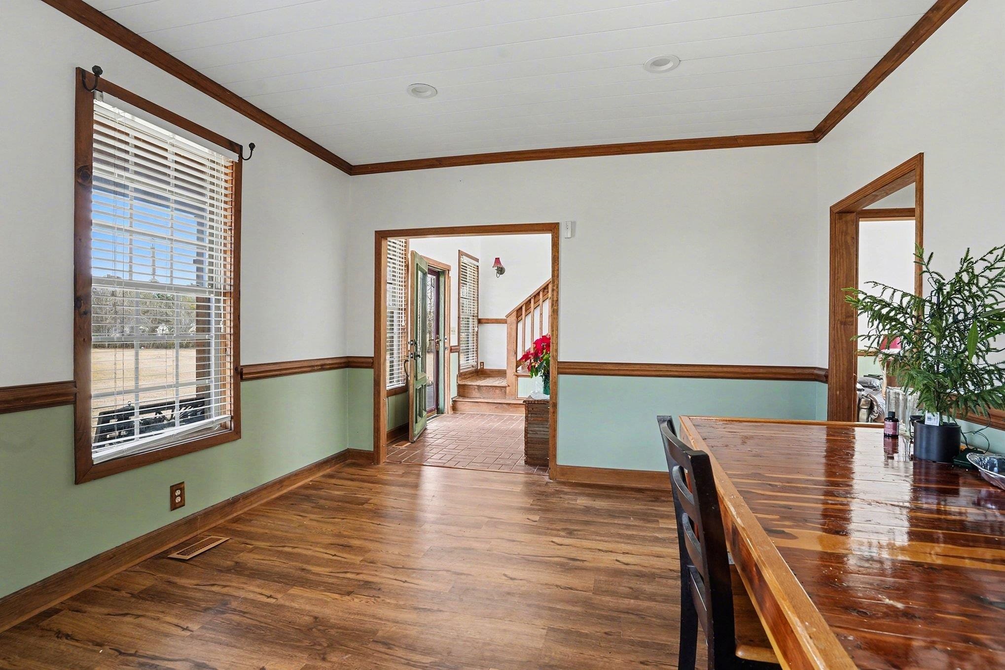202 Highway 747 Loris Sc 29569 Loris, SC 29569 - Photo 8 of 34 Unfurnished dining area with dark wood finished floors and molding