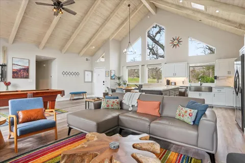 a living room with furniture ceiling fan and a rug