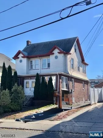 a front view of a house with yard