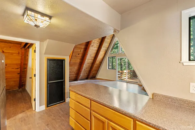 a view of a living room with a bed and a window