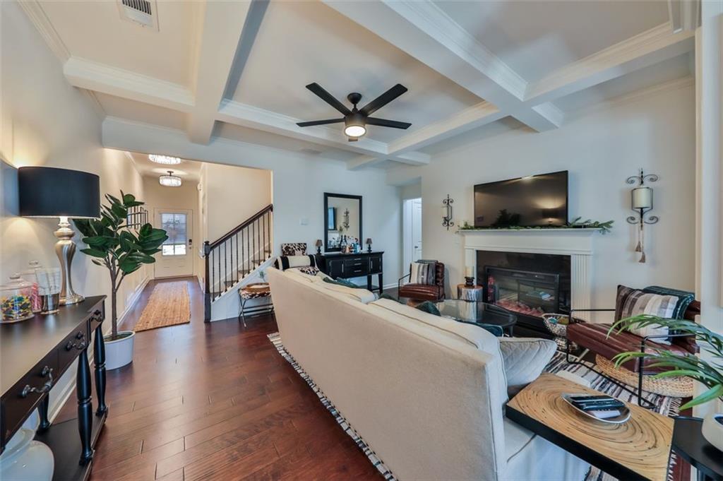 a living room with furniture fireplace and a flat screen tv