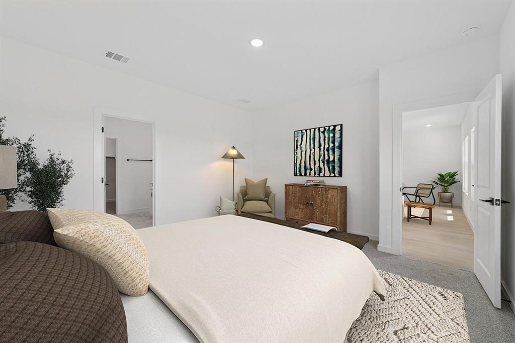 1412 Elliott Road Howe, TX 75459 - Photo 14 of 26 a bedroom with a bed and lamp