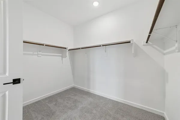 a view of an empty walk in closet