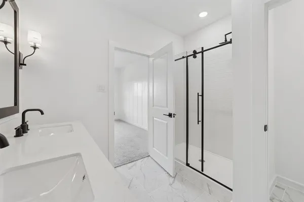 a bathroom with a tub and a sink