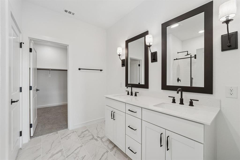 1412 Elliott Road Howe, TX 75459 - Photo 20 of 26 a bathroom with double sink and a mirror