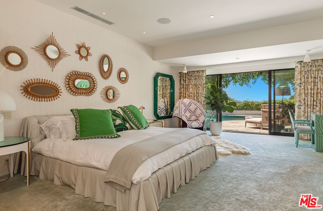 1070 North Hillcrest Road Beverly Hills, CA 90210 - Photo 14 of 29 a bedroom with a bed and a large window