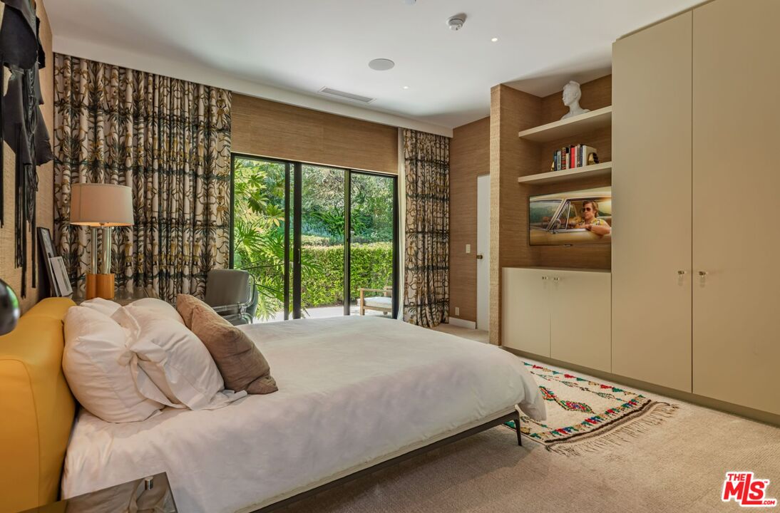 1070 North Hillcrest Road Beverly Hills, CA 90210 - Photo 18 of 29 a bedroom with bed and a window