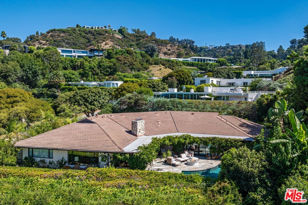 1070 North Hillcrest Road Beverly Hills, CA 90210 - Photo 25 of 29 an aerial view of a house with garden space and lake view