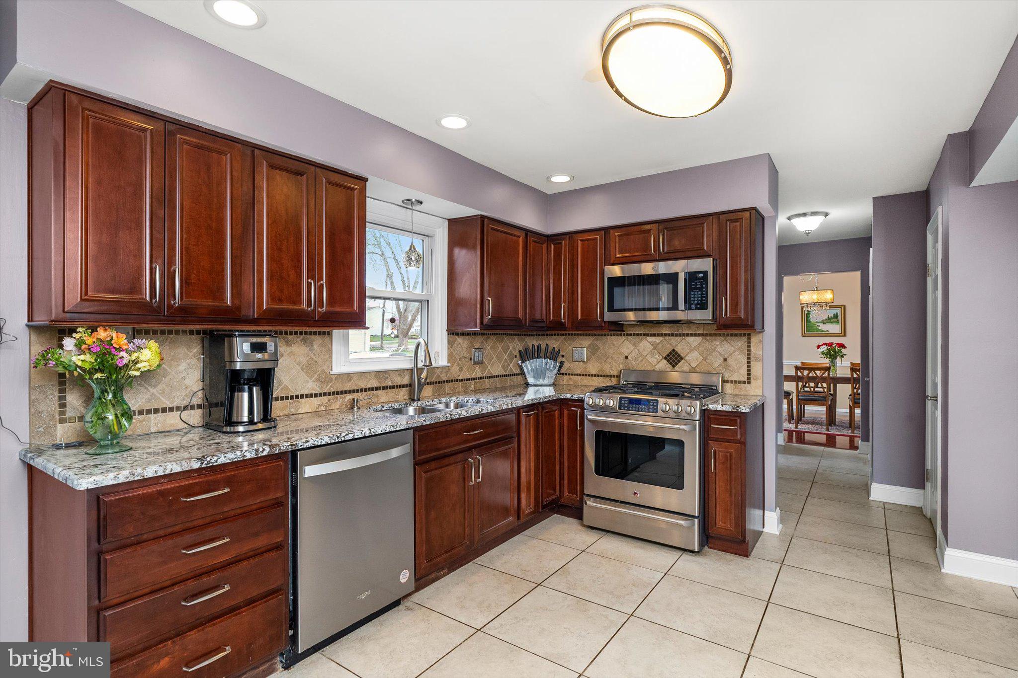 22 Hoffman Drive Hamilton, NJ 08690 - Photo 12 of 34 a kitchen with granite countertop stainless steel appliances and cabinets