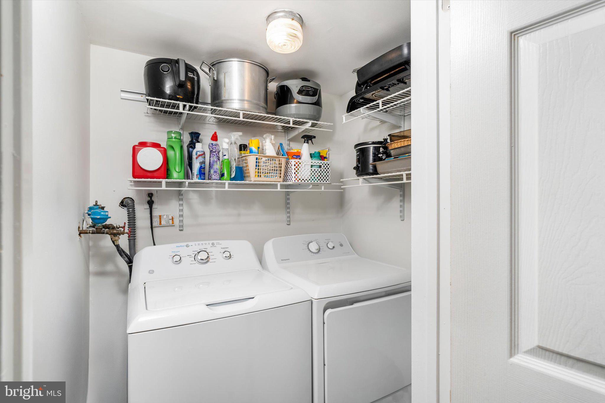 22 Hoffman Drive Hamilton, NJ 08690 - Photo 16 of 34 a utility room with dryer washer and empty racks
