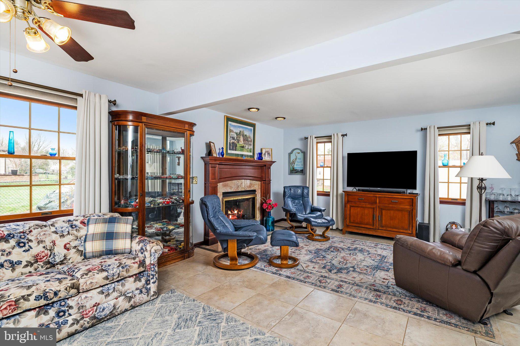22 Hoffman Drive Hamilton, NJ 08690 - Photo 18 of 34 a living room with furniture a flat screen tv and a large window