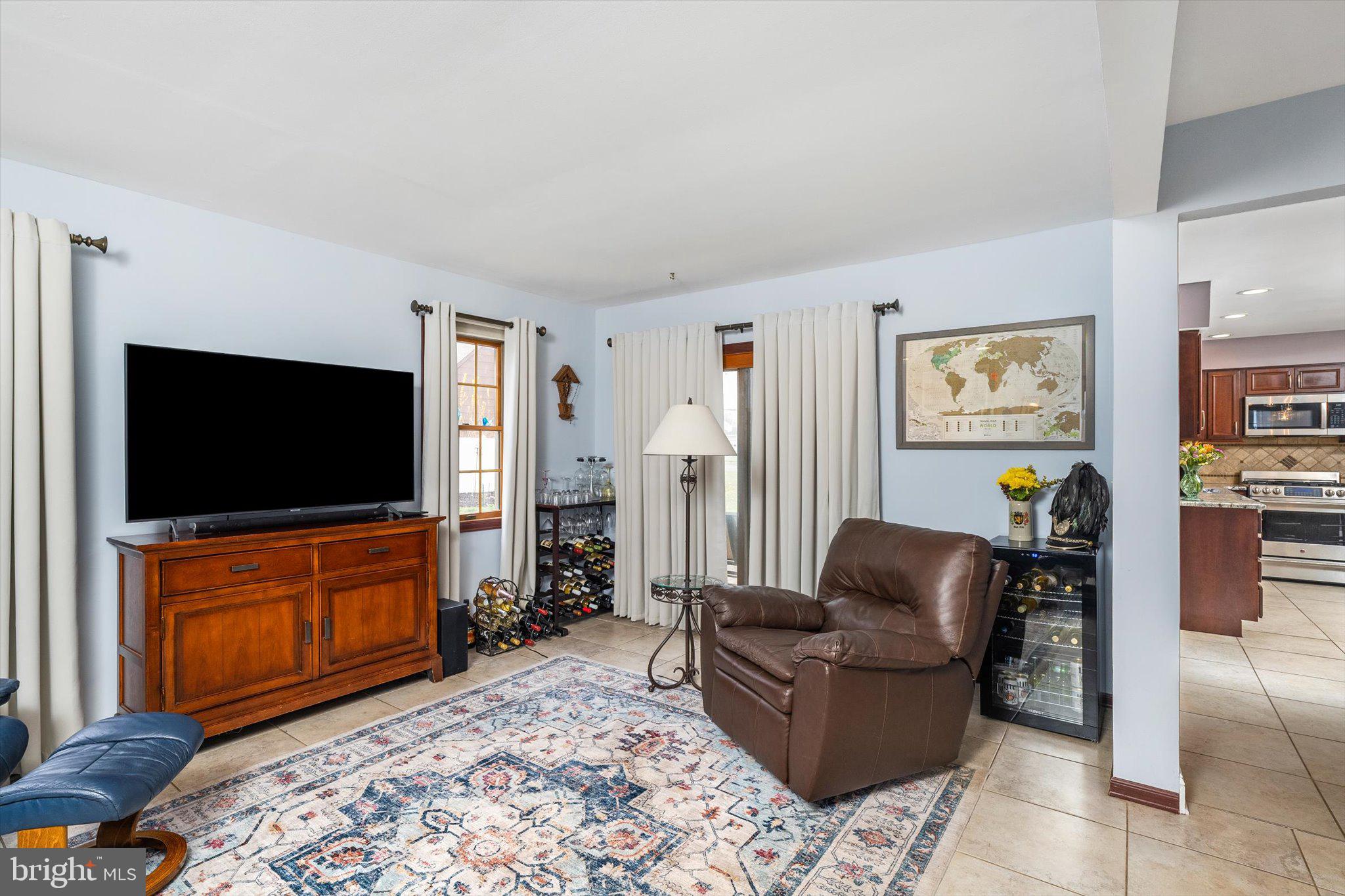 22 Hoffman Drive Hamilton, NJ 08690 - Photo 20 of 34 a living room with furniture and a flat screen tv