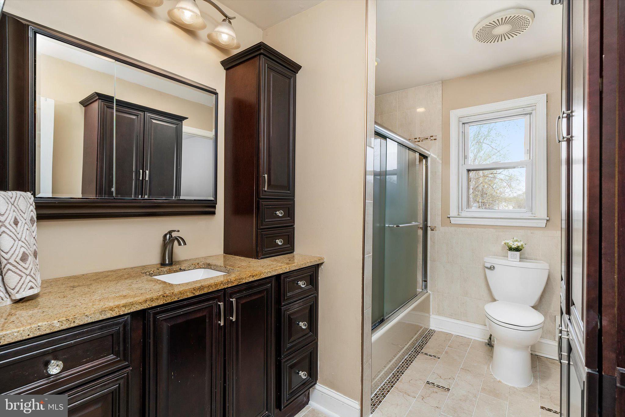 22 Hoffman Drive Hamilton, NJ 08690 - Photo 21 of 34 a bathroom with a granite countertop toilet sink and mirror
