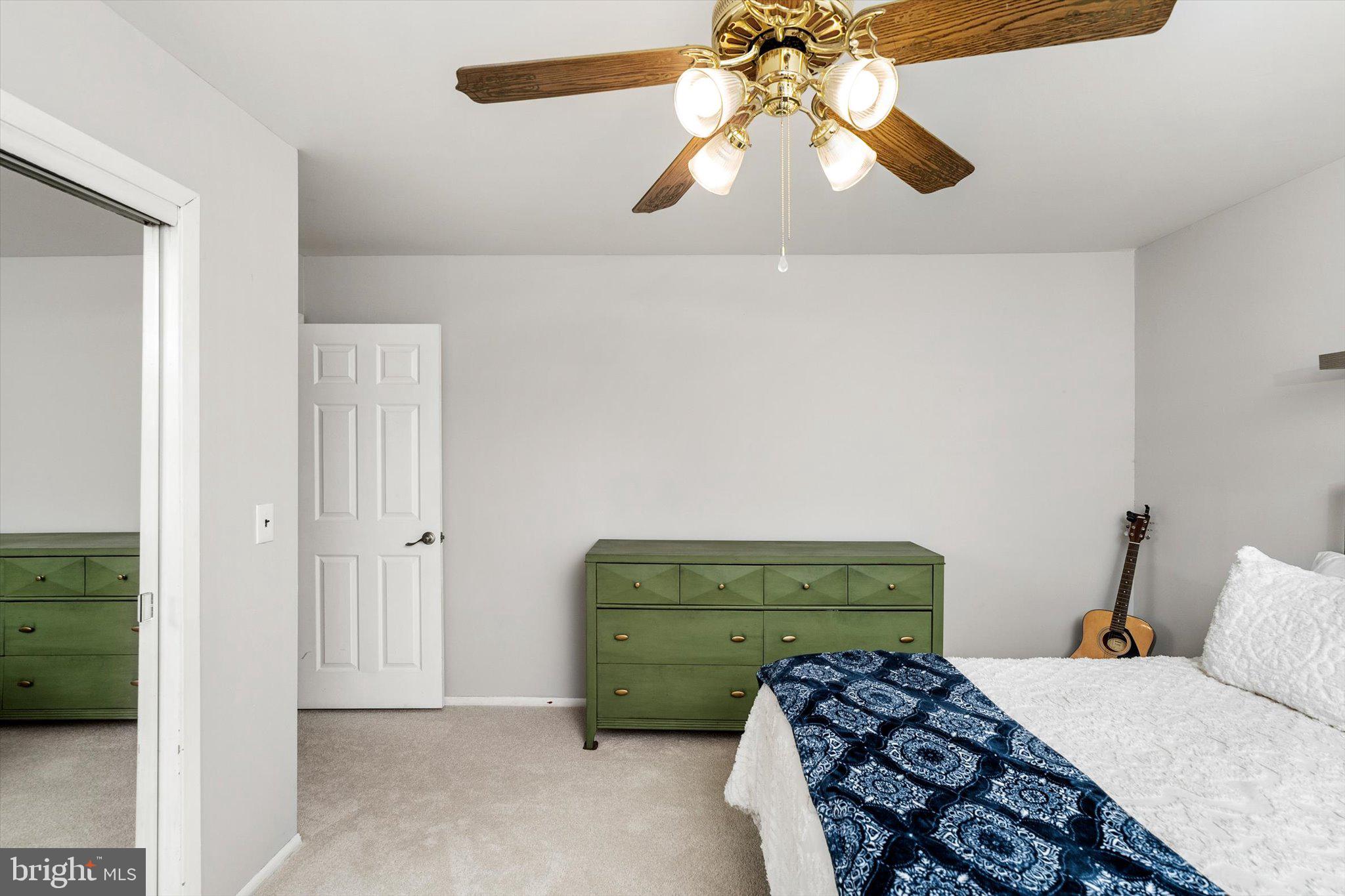 22 Hoffman Drive Hamilton, NJ 08690 - Photo 25 of 34 a bedroom with a bed and a chandelier