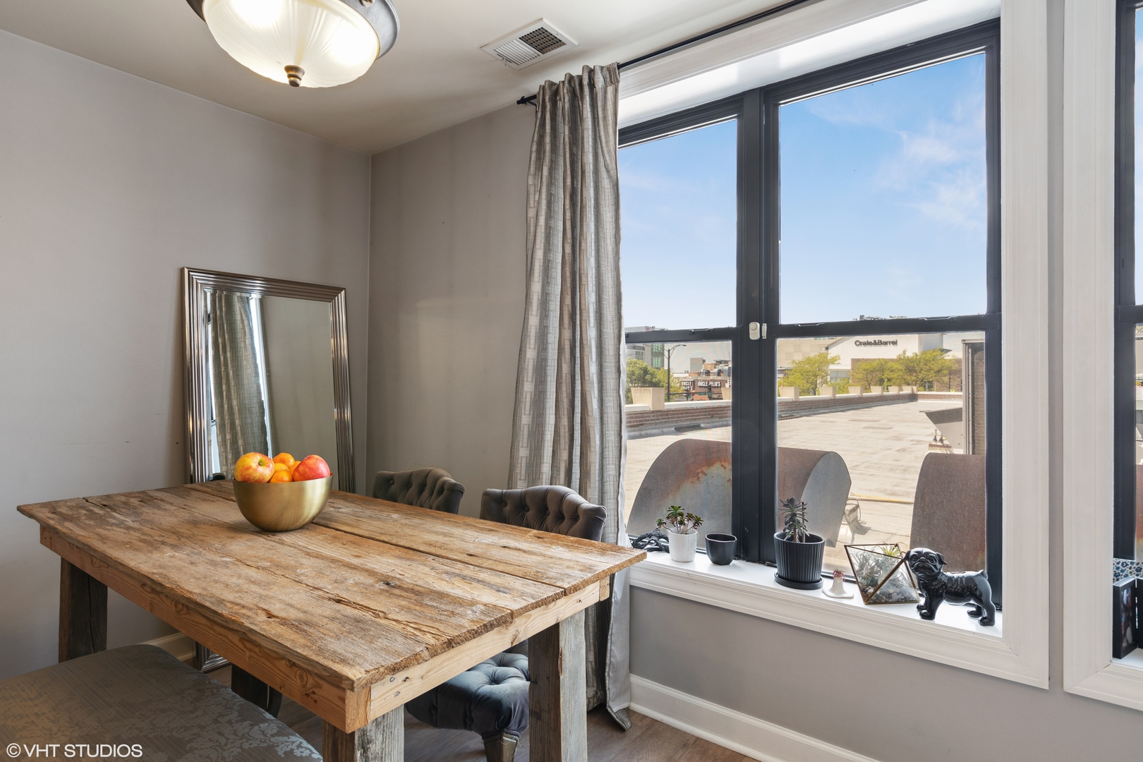 1600 North Halsted Street, Unit 2J Chicago, IL 60614 - Photo 5 of 13 a kitchen with a wooden table and chairs