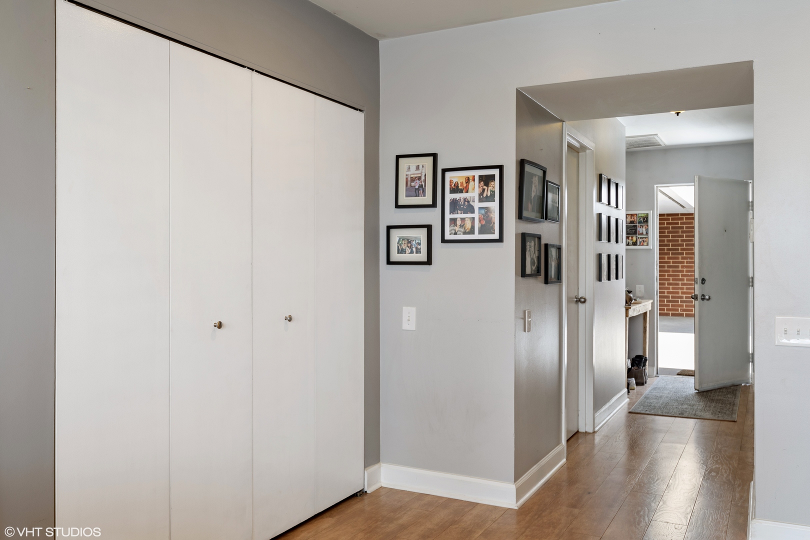 1600 North Halsted Street, Unit 2J Chicago, IL 60614 - Photo 7 of 13 a view of a hallway with wooden floor