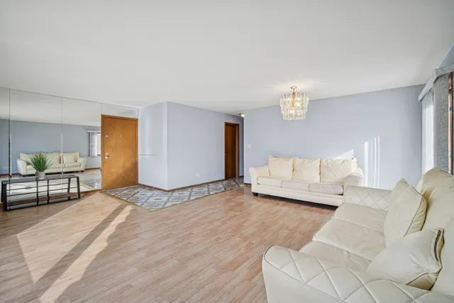 a spacious bedroom with a bed and a couch