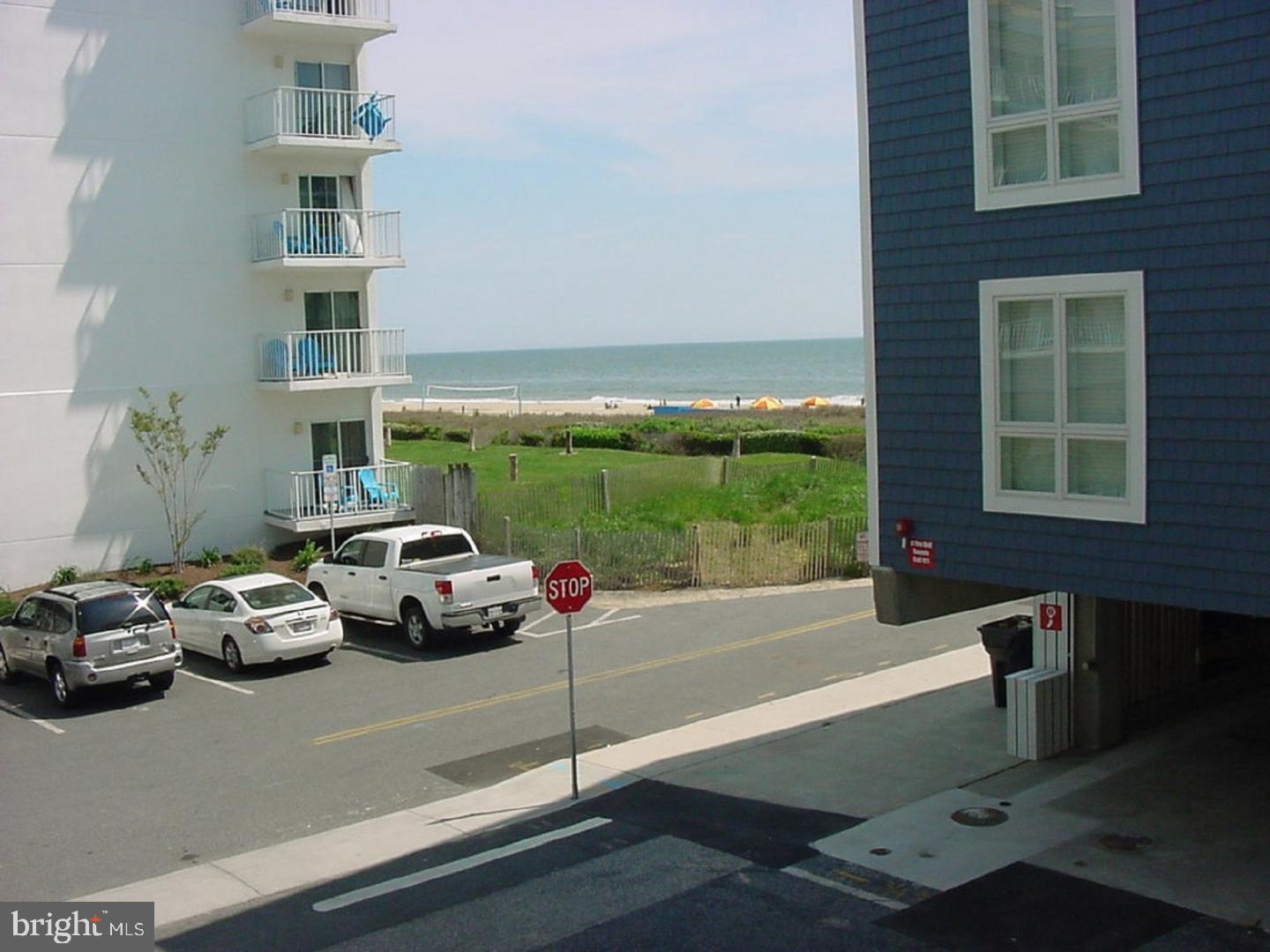11 91st Street, Unit 102 Ocean City, MD 21842 - Photo 19 of 43 a view of a patio with a table and chairs