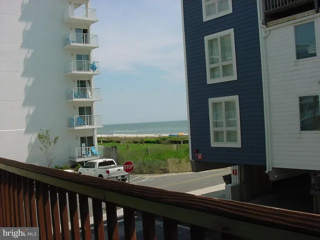 a view of a balcony with two chairs